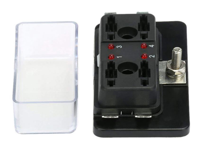 Black electrical component with connectors and a clear plastic cover on a white background