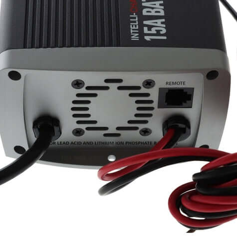 Back view of a battery charger with visible wiring and branding on a white background
