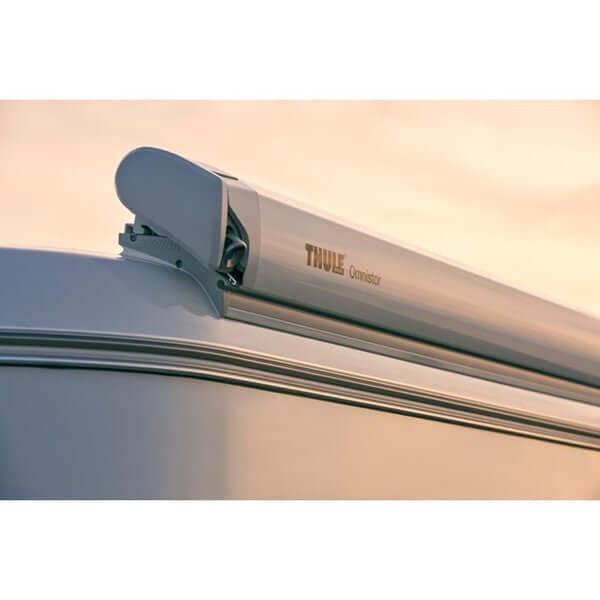 RV slide out awning installation featuring a Thule awning mounted on a campervan roof.