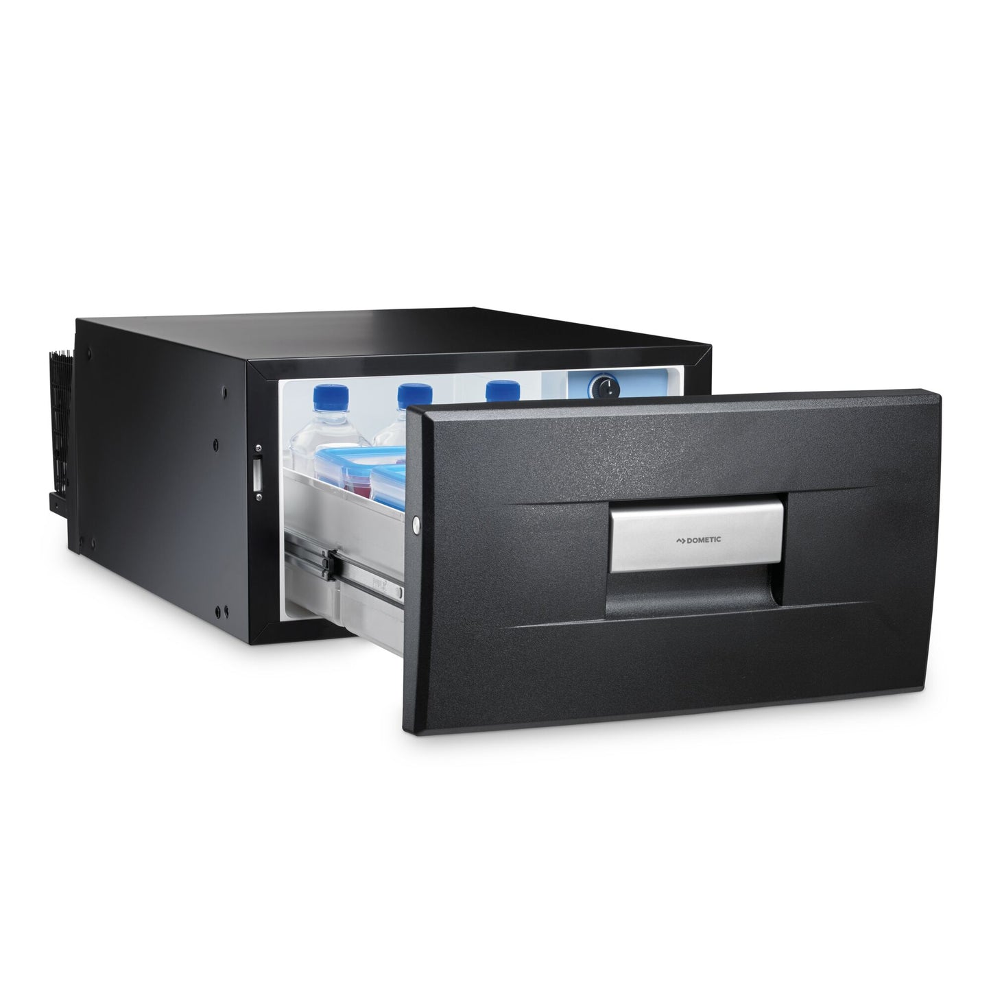 Dometic CD30 drawer fridge open, showcasing water bottles inside, designed for compact spaces in campervans.