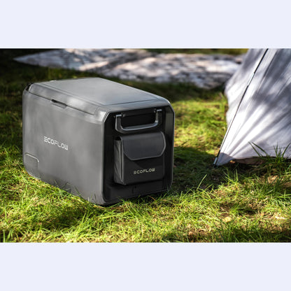 EcoFlow Glacier Portable Fridge Freezer on grass at campsite beside tent, compact 12V fridge for camping