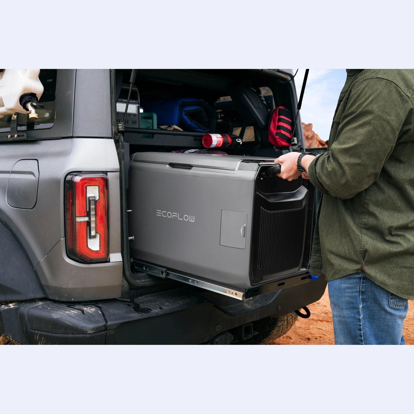 EcoFlow Glacier Portable Fridge Freezer being loaded into 4WD boot, ideal campervan fridge for off-grid travel