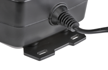 Black power adapter with a plug on a white background