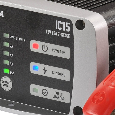 Close-up of a power supply device with LED indicators and branding.