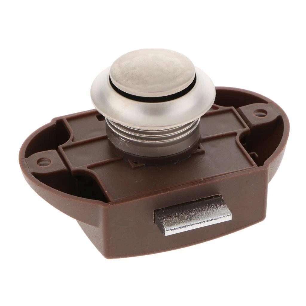 Brown plastic component with a metallic knob on a white background