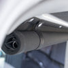 Black roll-up curtain fitted inside a van
