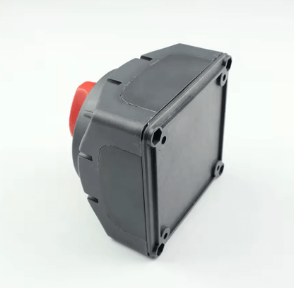 Black rectangular switch with red button on a white background

