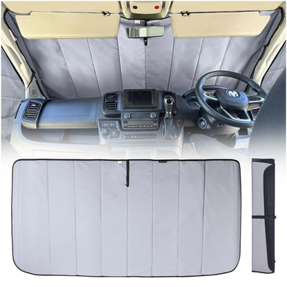 Car interior with a sunshade covering the windshield, dashboard, and steering wheel.