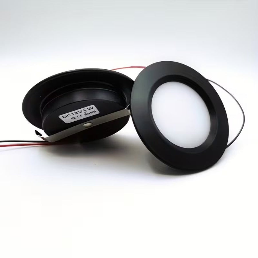 Two black LED lights on a white background