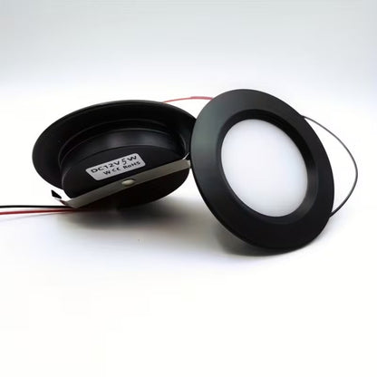 Two black LED lights on a white background