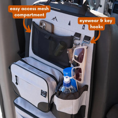 Car organizer with easy access mesh compartment, eyewear and key hooks, and bottle holder.