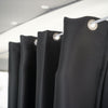 Black curtains with silver rings on a white background