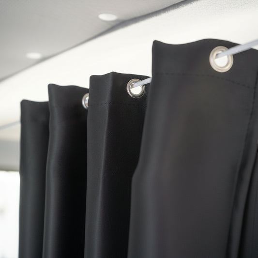 Black curtains with silver rings on a white background