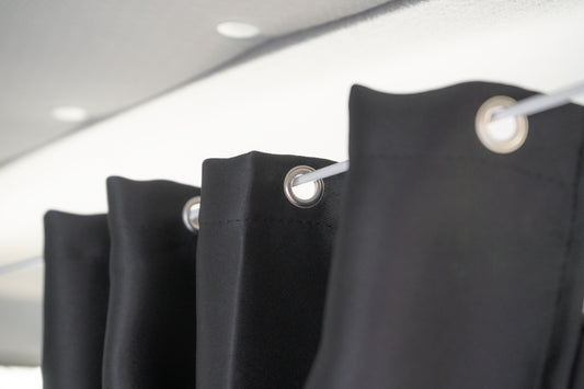 Black curtains with silver rings on a white background