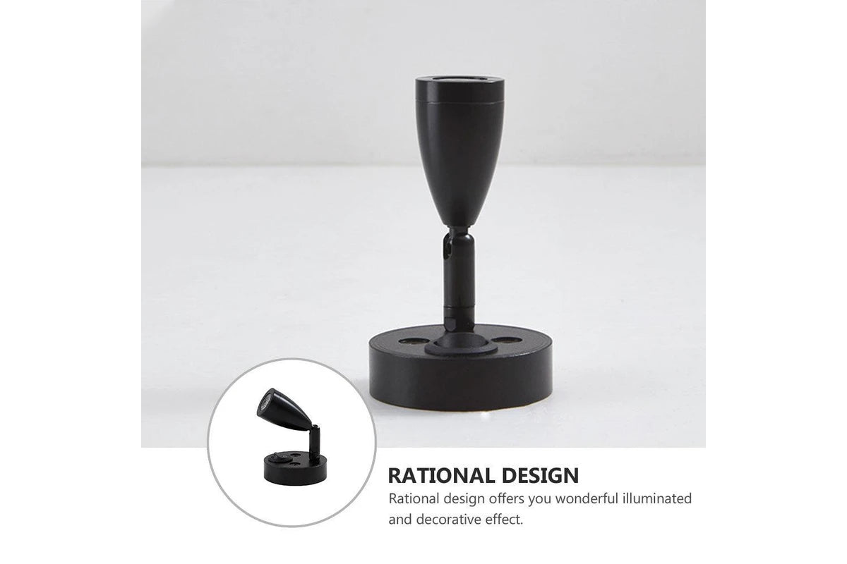 Black lamp stand with rational design text on a white background