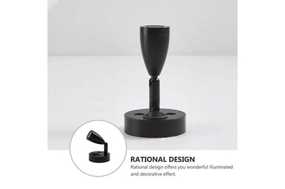 Black lamp stand with rational design text on a white background