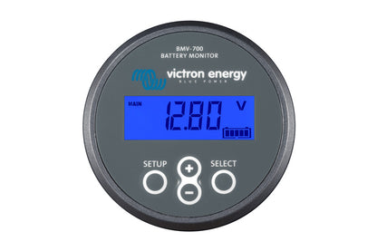 A digital display of the Victron Energy Battery Monitor BMV-700 showing battery voltage and power metrics.