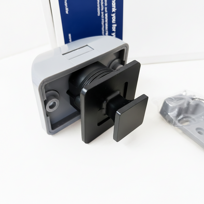 Side view of flush-mounted push button cabinet latch showing locking mechanism and striker plate