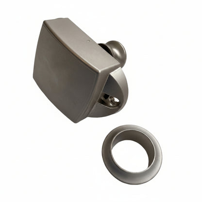 Side profile of large nickel push button catch showing latch mechanism