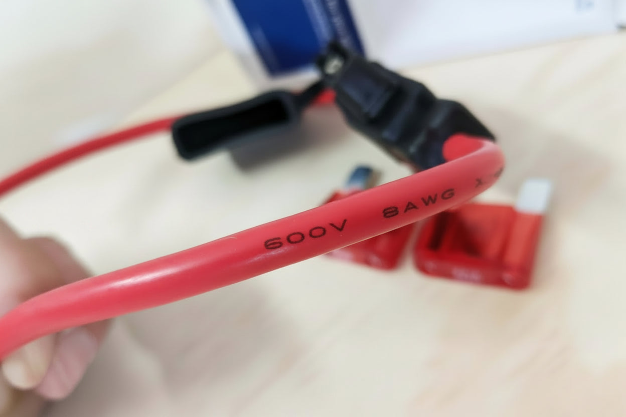 Close-up of Maxi Blade fuse holder connected to high-current 12V wiring