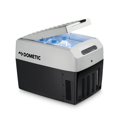Dometic TCX 14 portable fridge with bottles inside, compact design for campervans and outdoor use.
