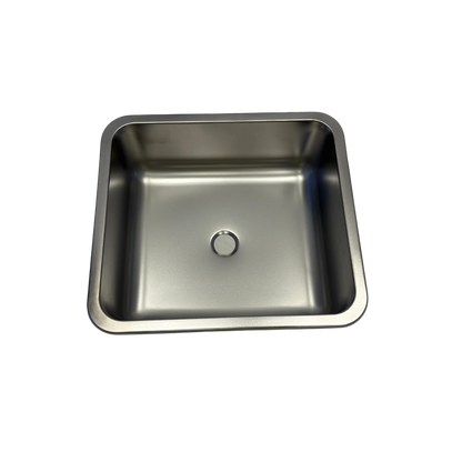 Stainless steel kitchen sink on a white background
