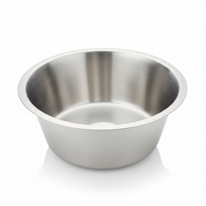 Stainless steel bowl on a black mat with a blurred background
